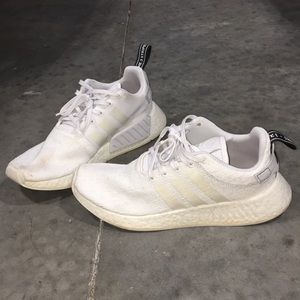 All white adidas NMDs